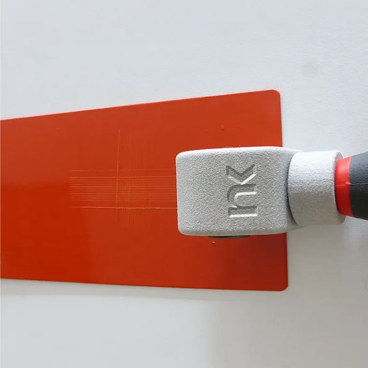 CC2000-Cross-Cut-Adhesion-Tester-Creating-Cross-Hatch-Grid-On-Red-Coated-Test-Panel.webp